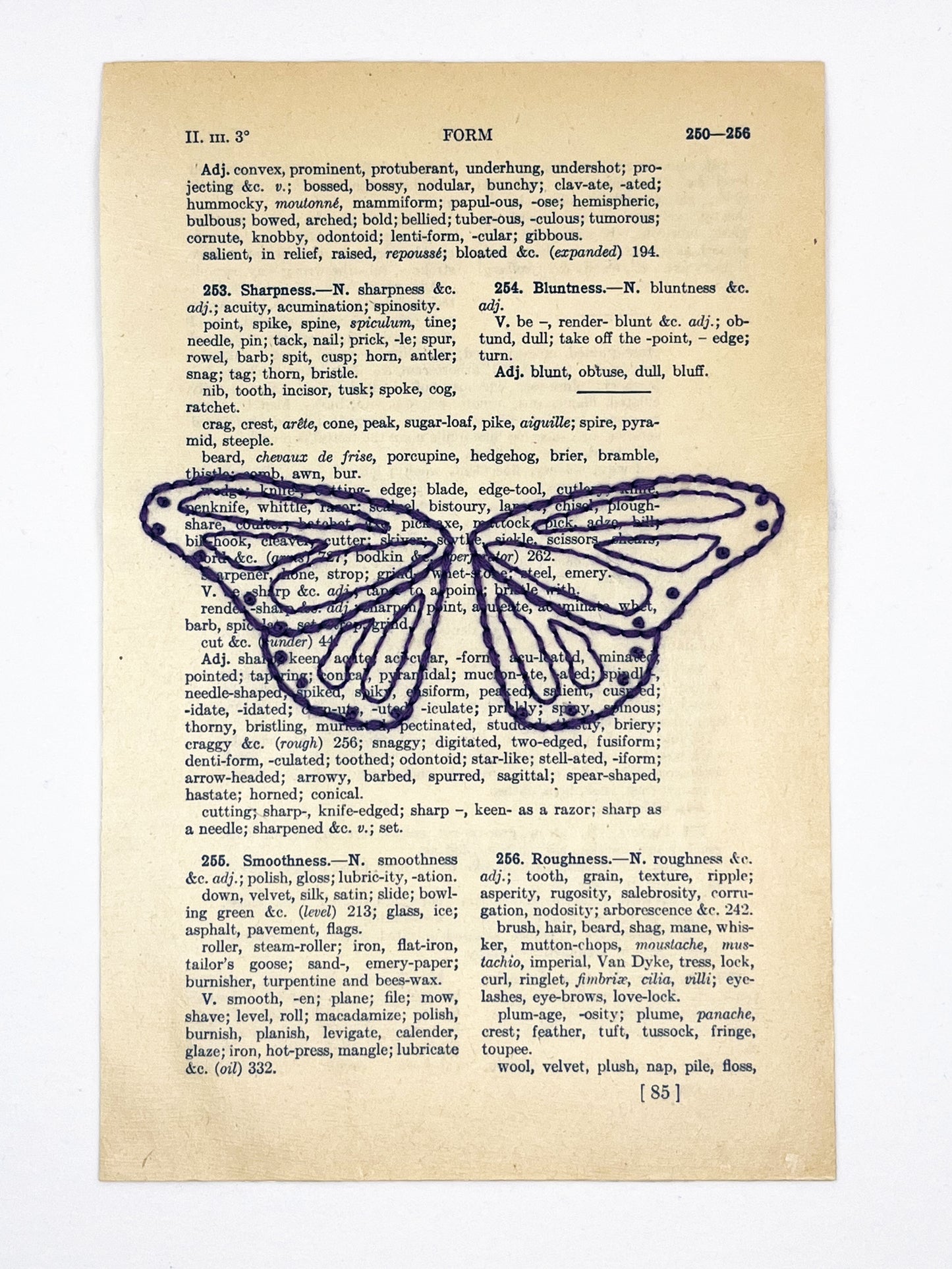 a vintage thesaurus page hand embroidered in eggplant colored thread with butterfly wings, on a white background