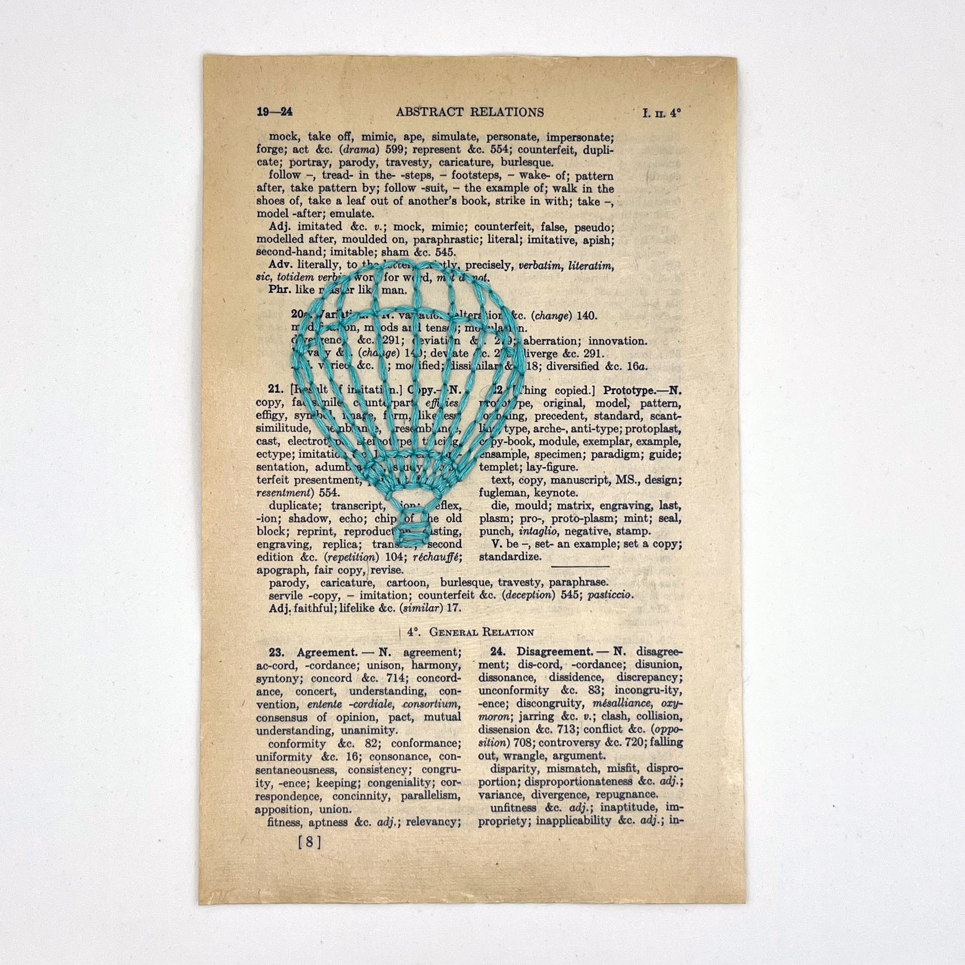 a vintage thesaurus page, hand stitched over with an outline of a hot air balloon in robin's egg blue thread on a white background