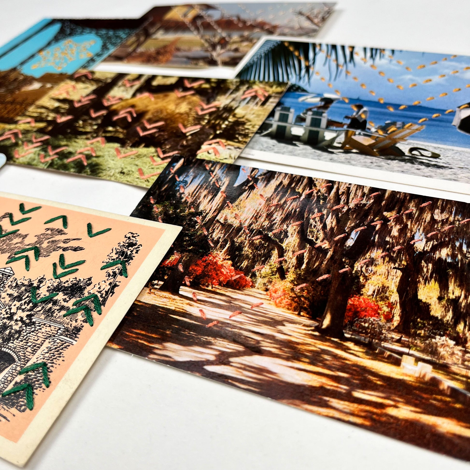 group of colorful vintage postcards hand stitched with different patterns of chevrons, in yellow, green and coral